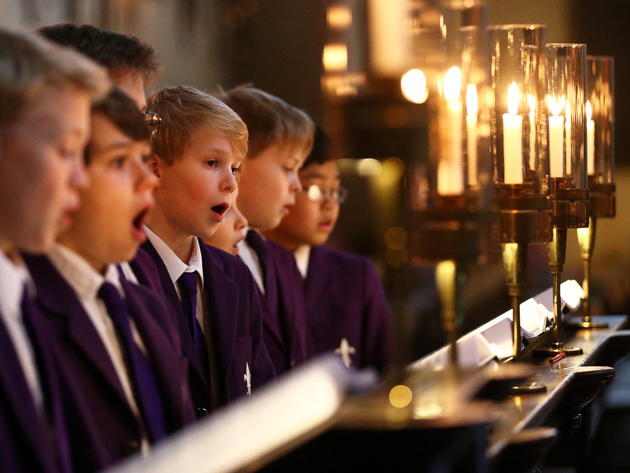 A school choir sings Christmas carols. Figures showed schools with no religious character admitted five per cent more pupils on free school meals