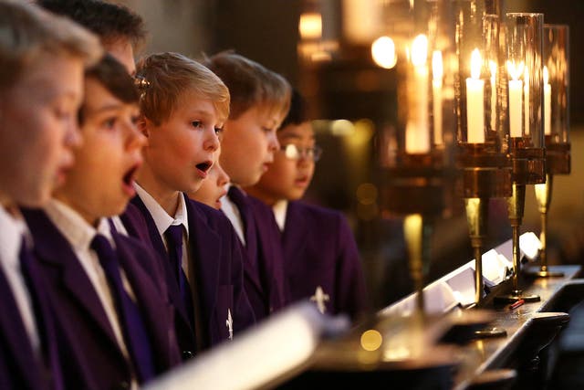 A school choir sings Christmas carols. Figures showed schools with no religious character admitted five per cent more pupils on free school meals