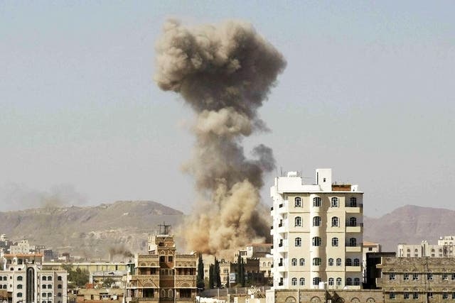Smoke rises after a Saudi-led airstrike hits an army base in Sanaa, Yemen.