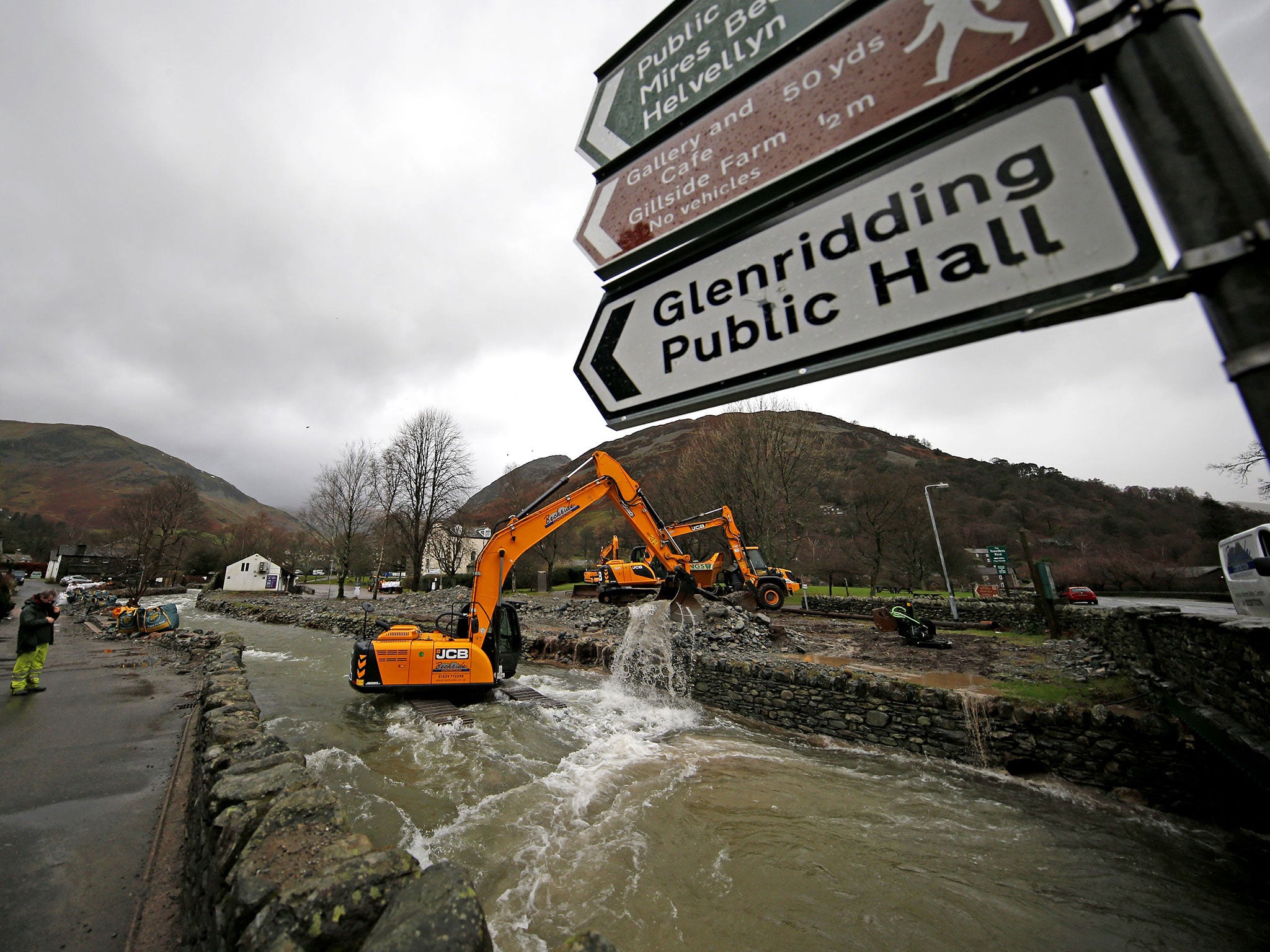 Glenridding Beck in Cumbria is dredged again to remove boulders and rocks, which were washed down from the fells during previous heavy rain, in order to prevent further flooding.