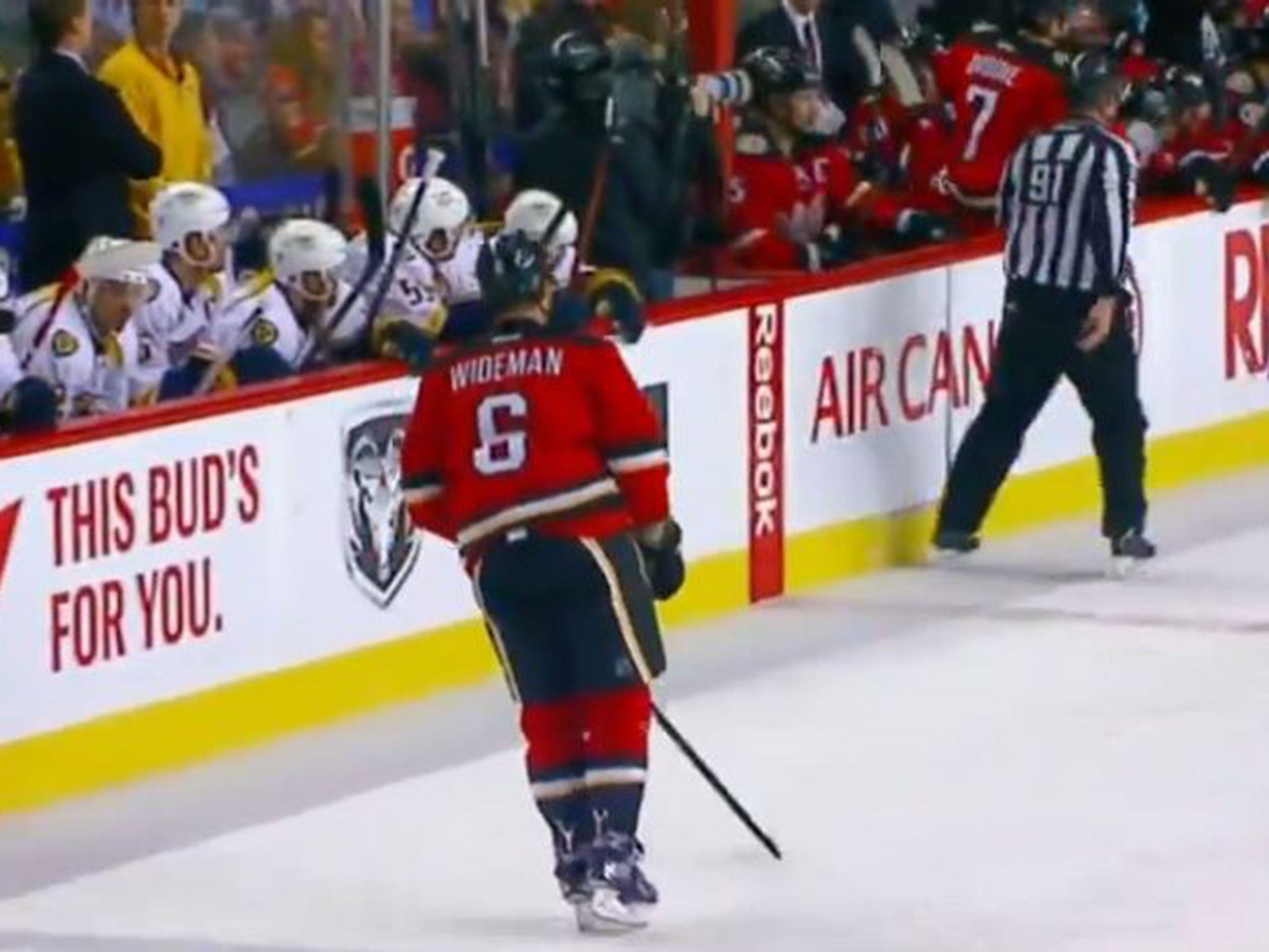 Wideman makes his way towards the bench as Henderson watches play