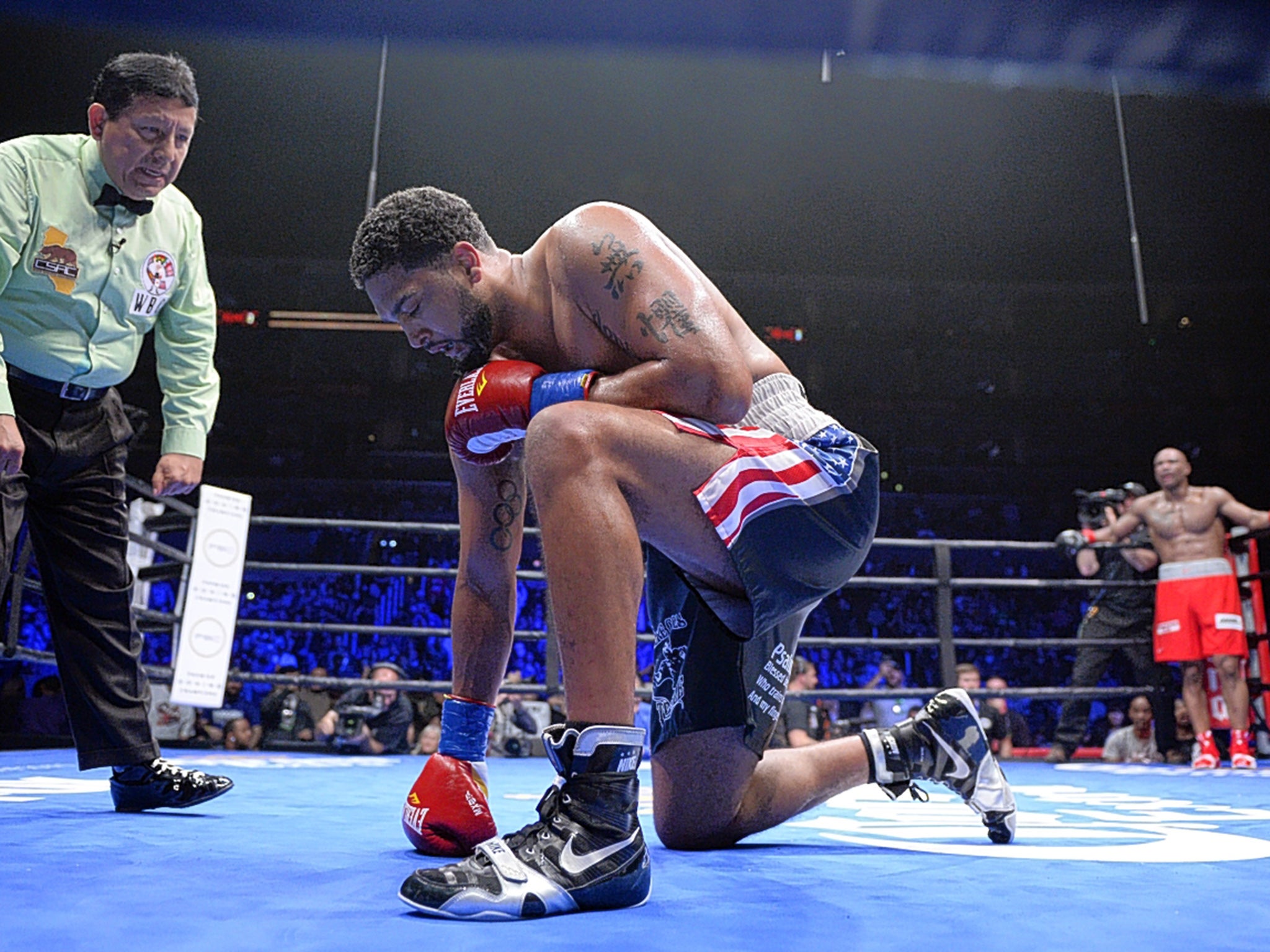 Dominic Breazeale is knocked down by Amir Mansour but recovers to win their heavyweight bout in California last Saturday