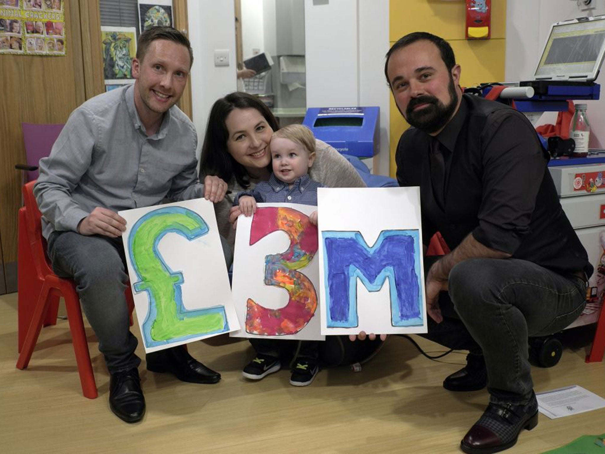 Elliott Livingstone, a patient at GOSH, and his parents, Adrian and Candace, celebrate with Evgeny Lebedev, owner of ‘The Independent’