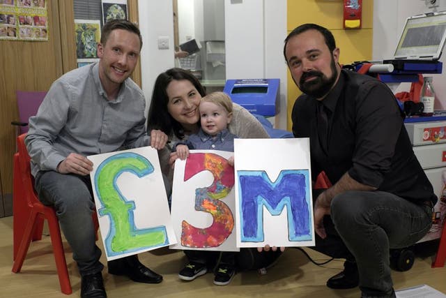 Elliott Livingstone, a patient at GOSH, and his parents, Adrian and Candace, celebrate with Evgeny Lebedev, owner of ‘The Independent’ (Jo