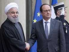 Rouhani signs €40bn in trade deals on French visit – but goes hungry