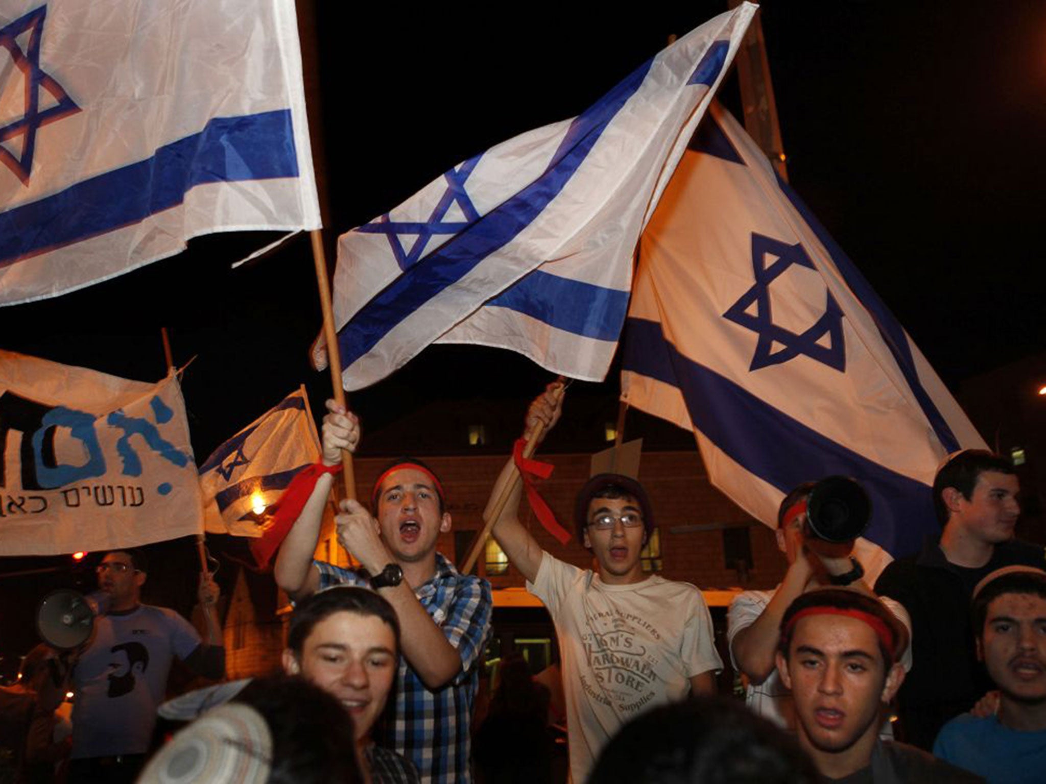 Israeli right-wing protesters from the Im Tirzu movement at a demonstration in Jerusalem in support of southern Israeli residents and Israel's ongoing military operation in the Gaza Strip