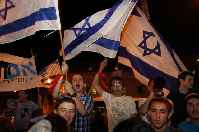 Israeli right-wing protesters from the Im Tirzu movement at a demonstration in Jerusalem in support of southern Israeli residents and Israel's ongoing military operation in the Gaza Strip