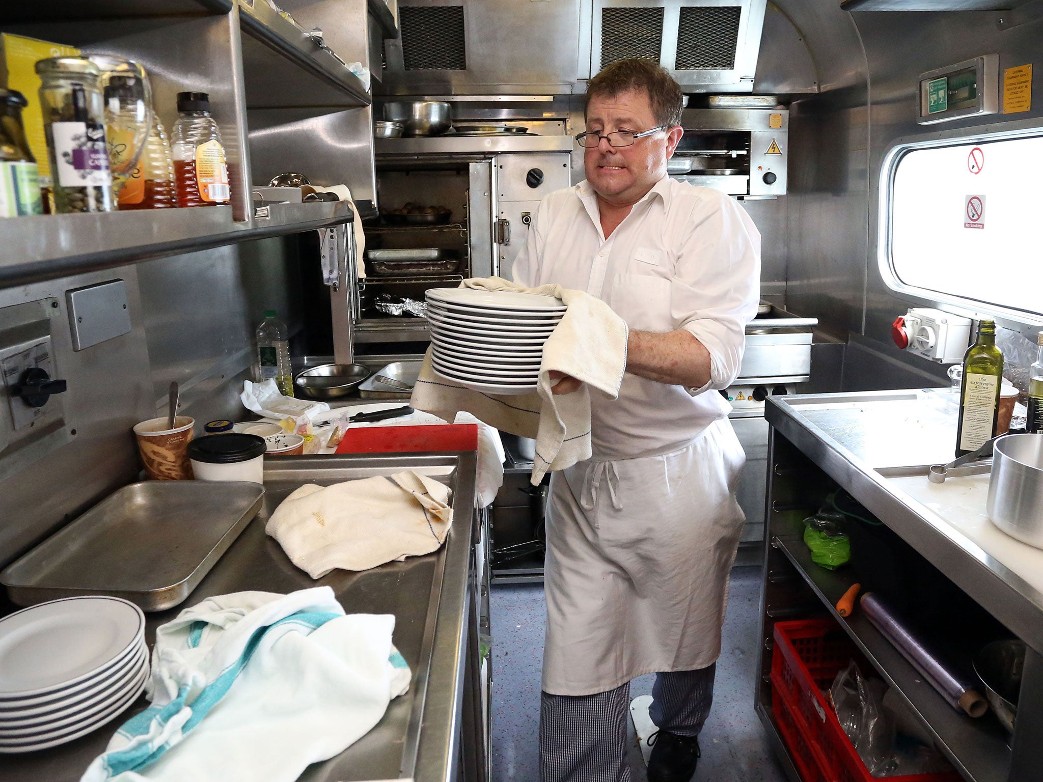 Chef Pete Downham prepares lunch for passengers in the Pullman dining car from London to Penzance