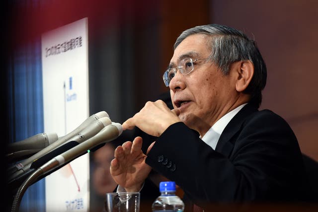 Governor of the Bank of Japan (BoJ) Haruhiko Kuroda answers a question during his regular press conference in Tokyo on January 29, 2016. The BoJ shocked markets on January 29 after it unveiled plans to effectively charge lenders to park their cash with it, ramping up its long-running battle to kickstart the world's number three economy.