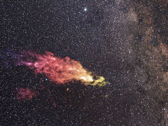A composite image shows the Smith Cloud on the edges of the galaxy