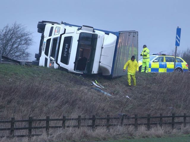 A lorry overturned on the M9 near Falkirk as winds of more than 90mph have hit the west of Scotland