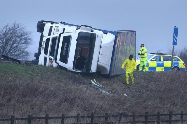 A lorry overturned on the M9 near Falkirk as winds of more than 90mph have hit the west of Scotland