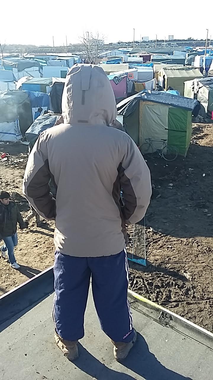 The anonymous writer looking over the camp at Calais