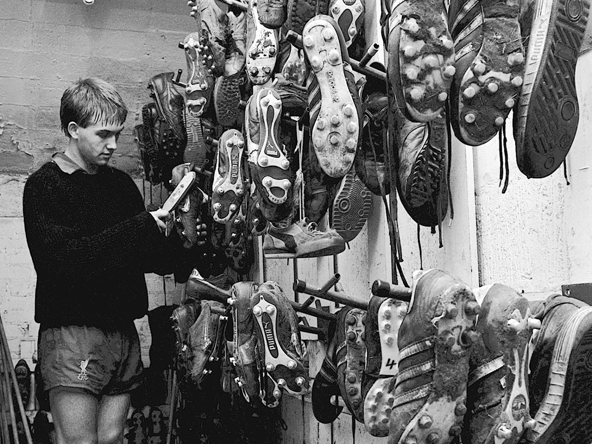 Liverpool youngster Mick Halsall cleans the boots at Anfield in 1983