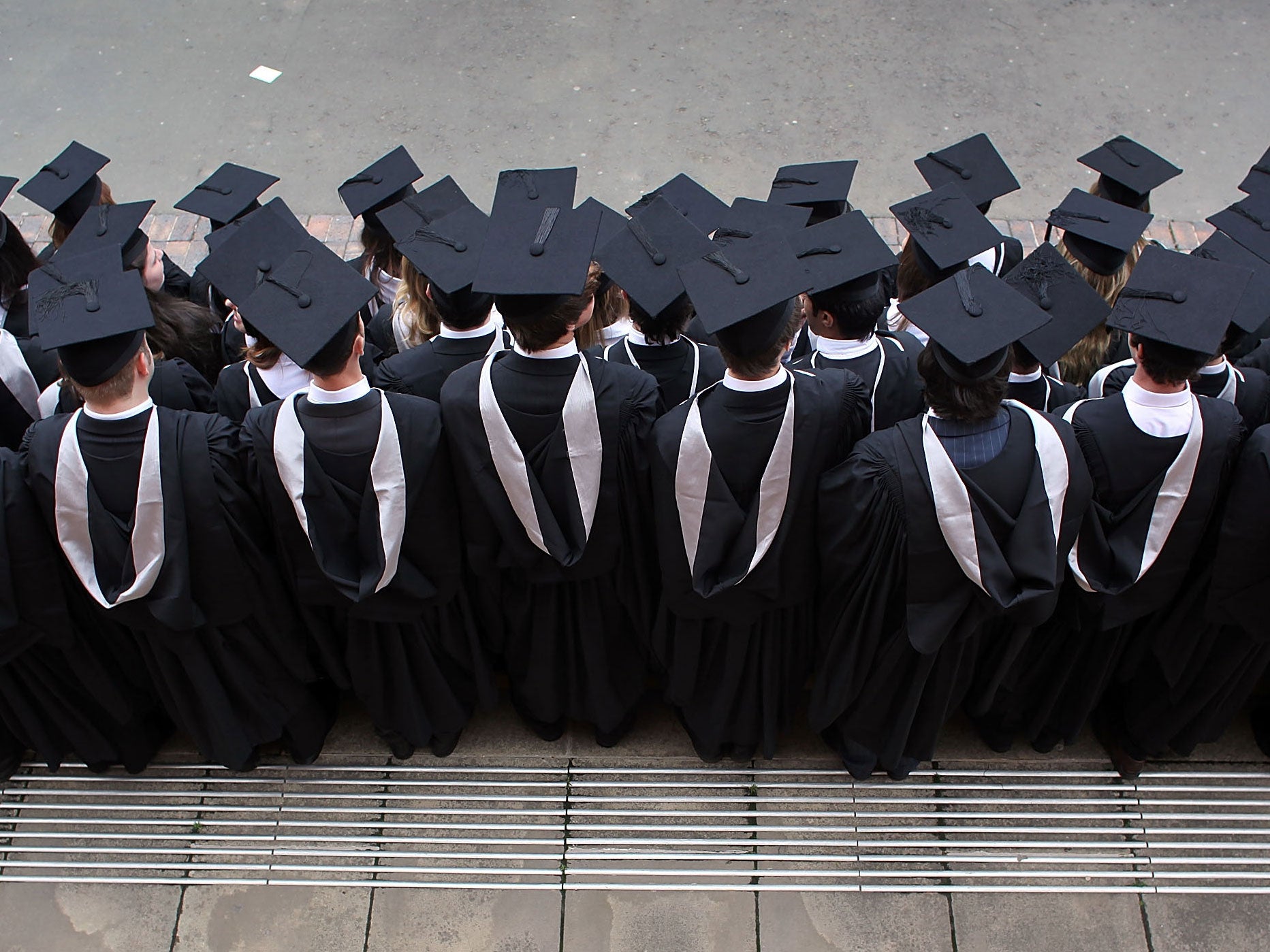 Students at the University of Birmingham pose for pictures after receiving their degrees