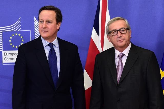 British Prime Minister David Cameron (L) is welcomed by European Commission president Jean-Claude Juncker prior to a meeting at the European Commission in Brussels.