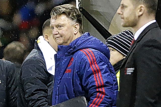 Louis van Gaal almost breaks into a smile after his Manchester United side’s victory at the iPro Stadium