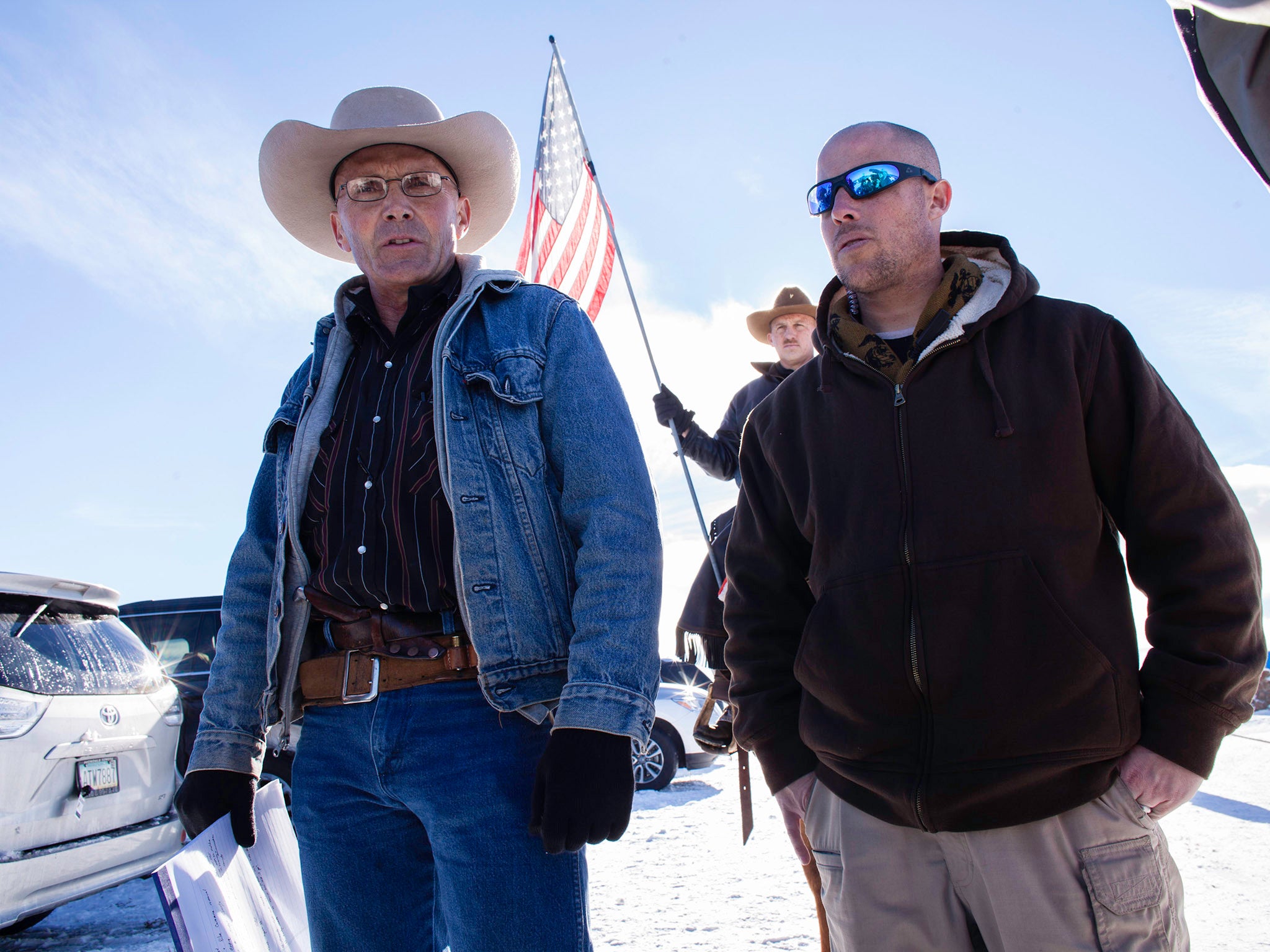 Rovert 'LaVoy' Finicum (left) was killed as he ran to a traffic stop during the Oregon siege