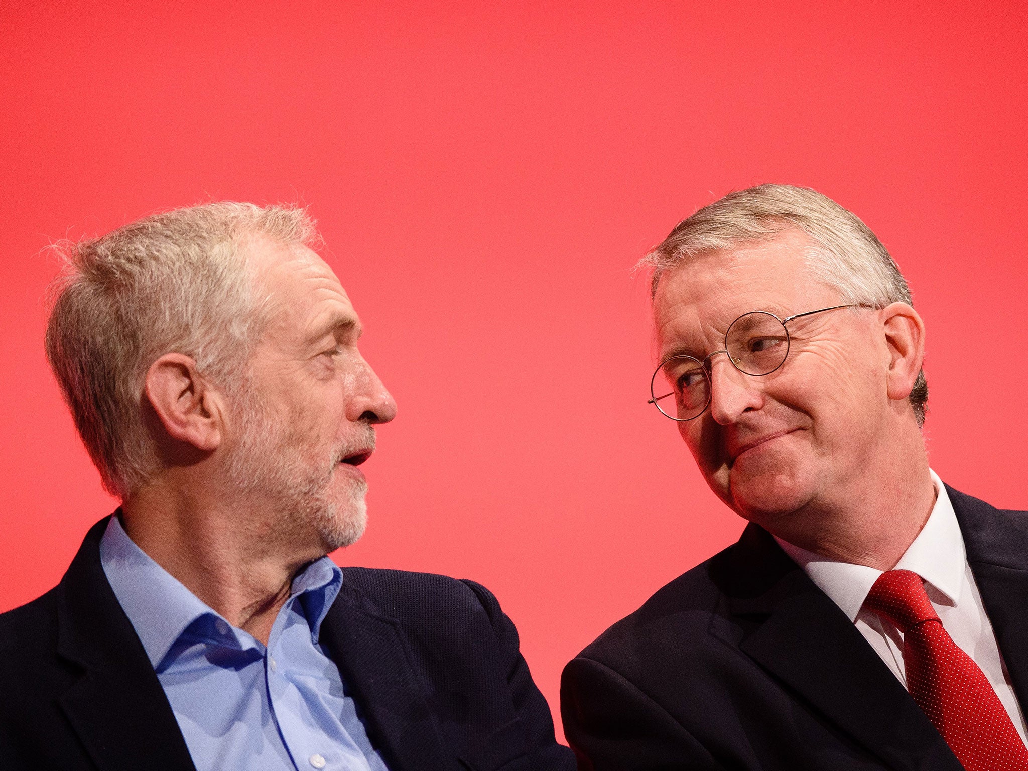 Leader of the opposition Labour Party Jeremy Corbyn speaks with with Shadow Foreign Secretary Hilary Benn on day two of the annual Labour party conference in Brighton on 28 September, 2015