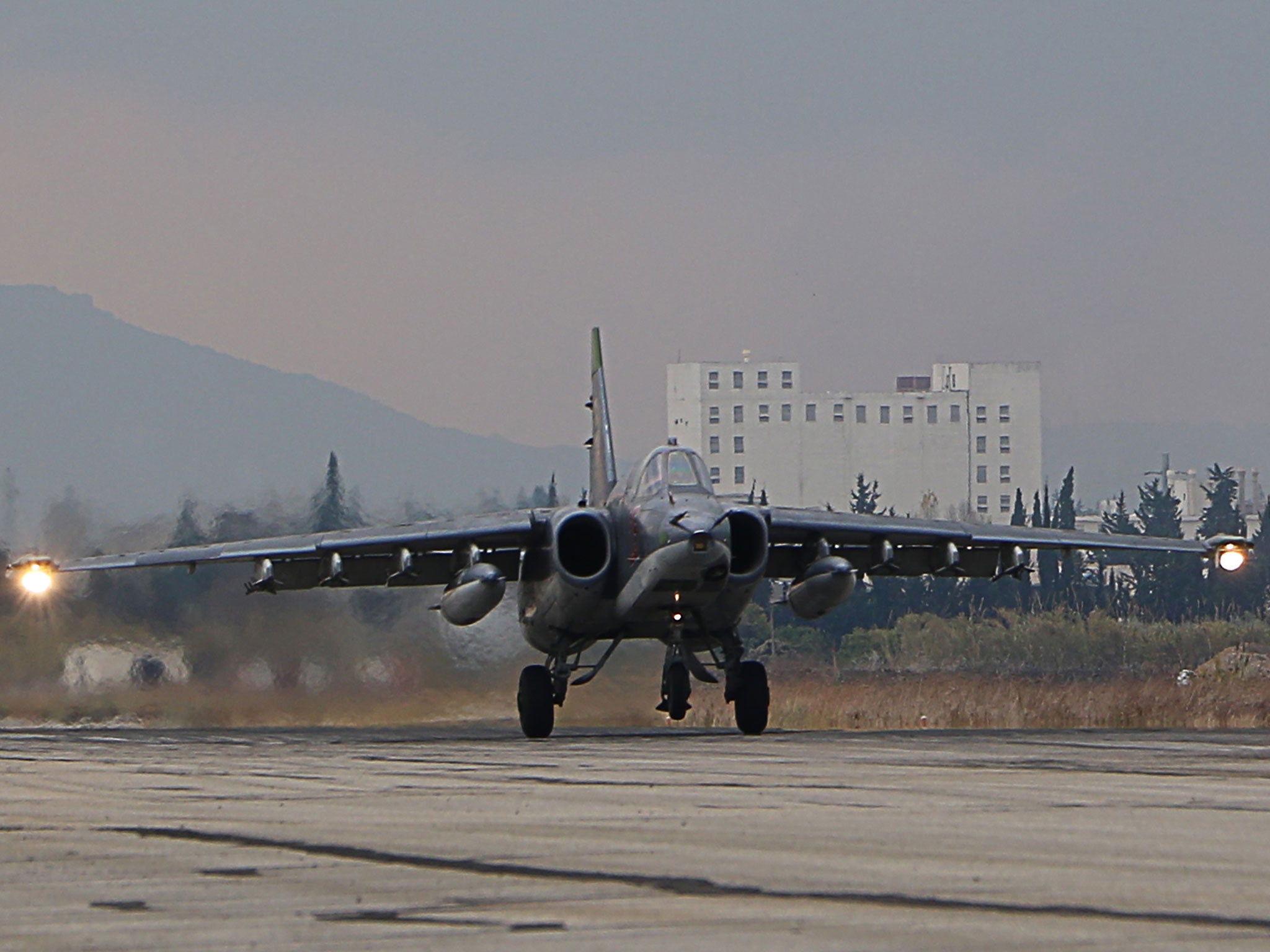 A Russian Sukhoi Su-34 bomber lands at the Russian Hmeimim military base in Latakia province, in the northwest of Syria, on 16 December, 2015