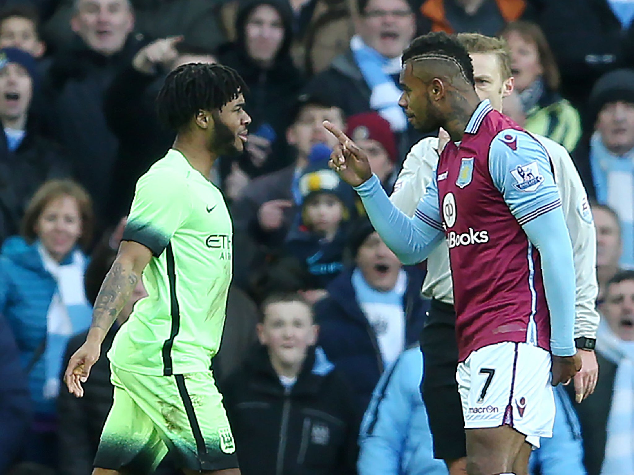 Raheem Sterling and Leandro Bacuna square up