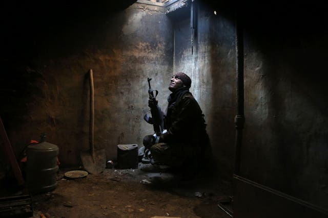 An anti-Assad fighter, in rebel-held Arbeen, near Damascus