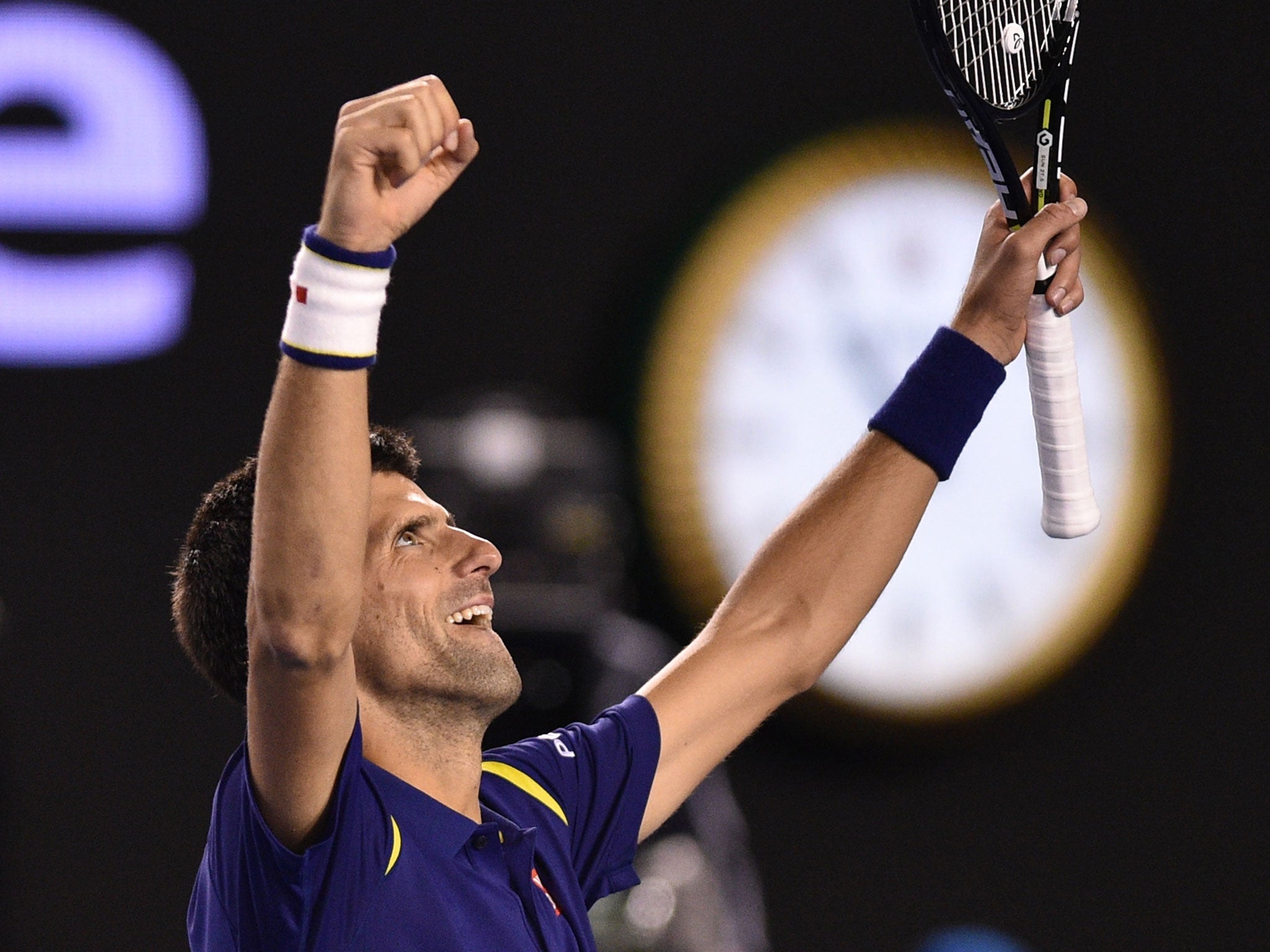 Novak Djokovic celebrates his victory over Andy Murray after winning a third-set tie-break