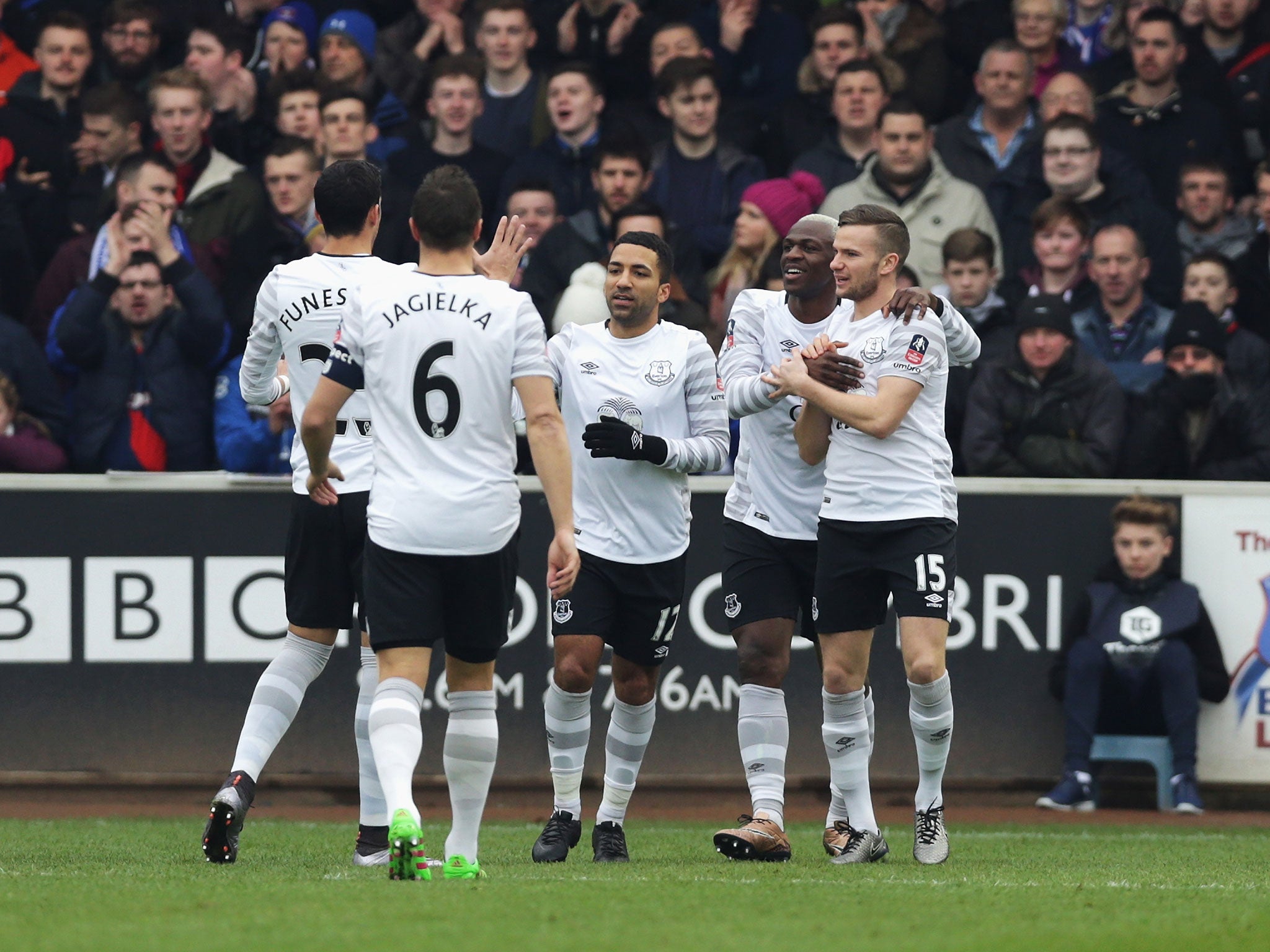 Everton players celebrate after Aaron Lennon (centre) scores their second against Carlisle