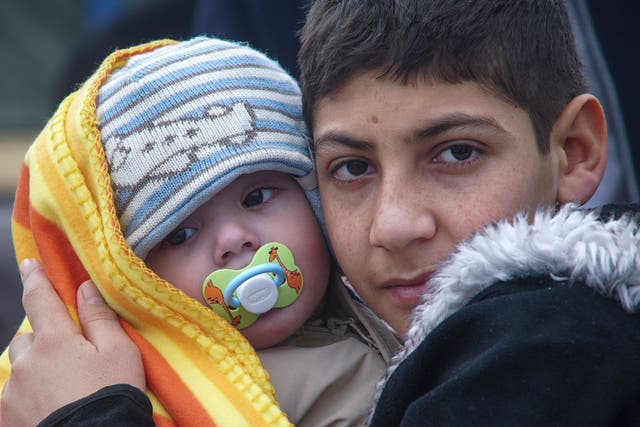 Two child refugees who reached the Greek island of Lesbos from Turkey