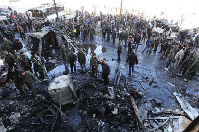 The aftermath of an Isis suicide bombing in which 60 people died near a Shia shrine in Sayyida Zeinab outside Damascus
