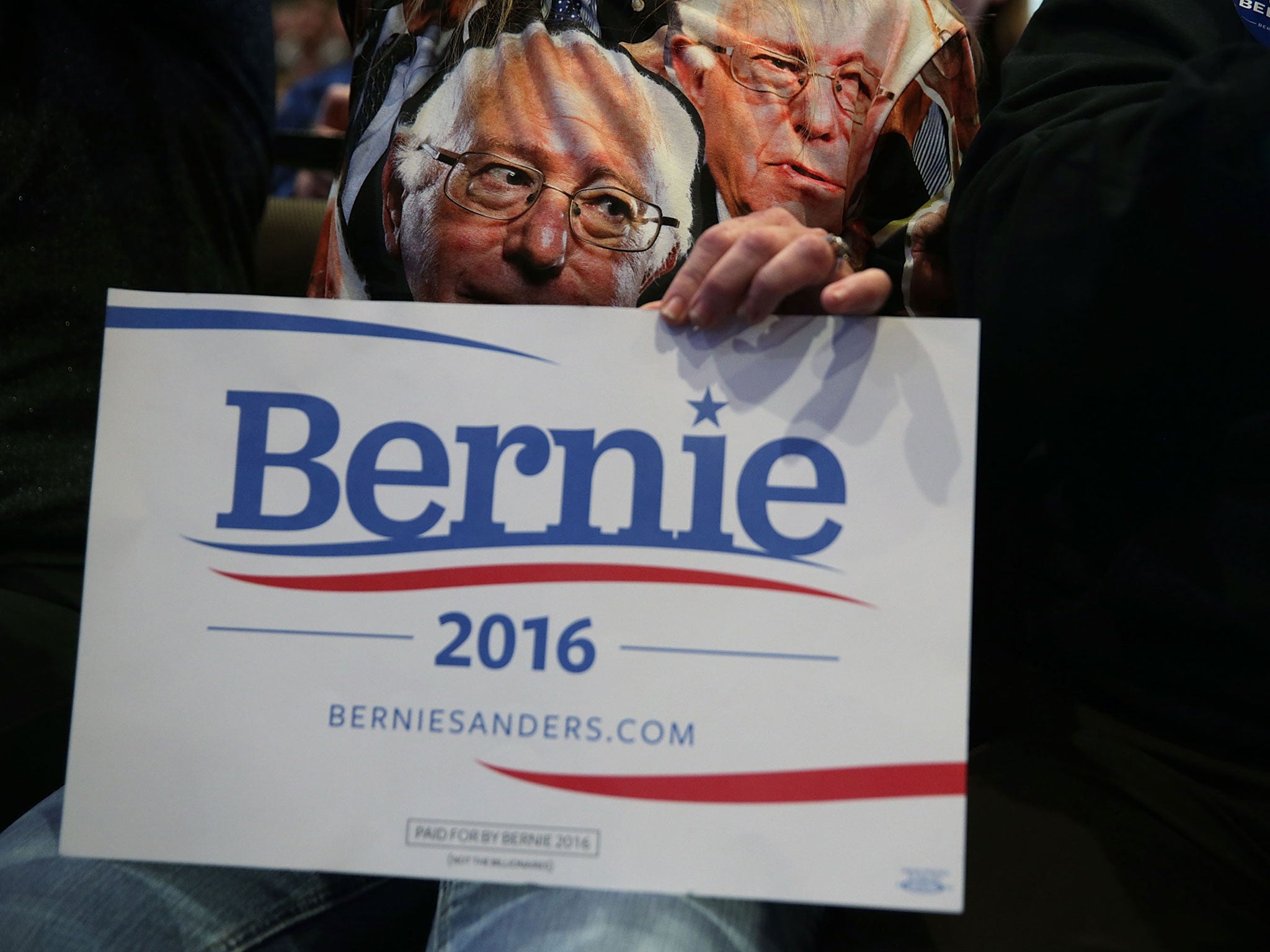 A supporter wears a T-shirt featuring Democratic presidential candidate Bernie Sanders