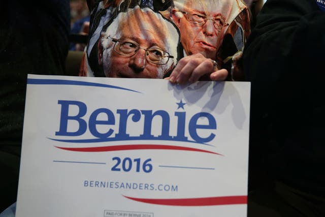 A supporter wears a T-shirt featuring Democratic presidential candidate Bernie Sanders