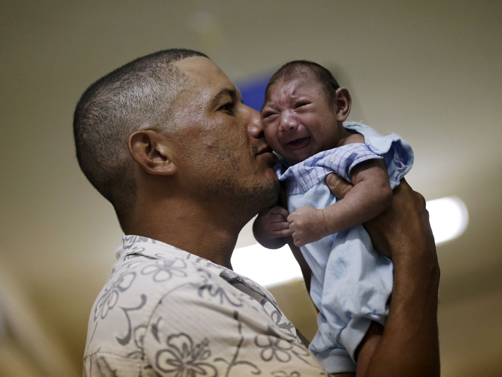 Geovane Silva holds his son Gustavo Henrique, who has microcephaly, at the Oswaldo Cruz Hospital in Recife, Brazil