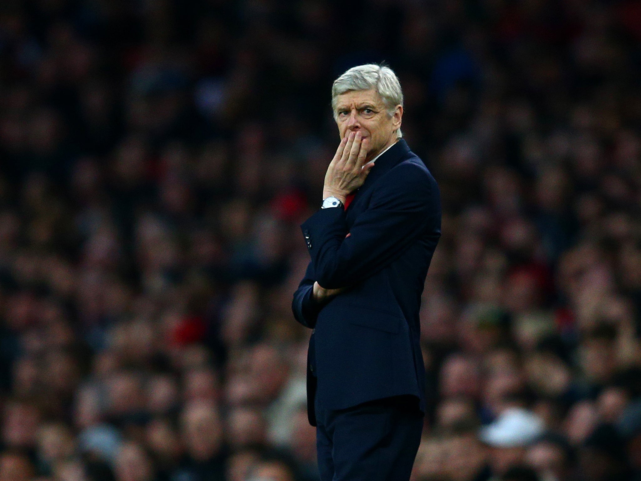 Arsene Wenger looks on from the touchline