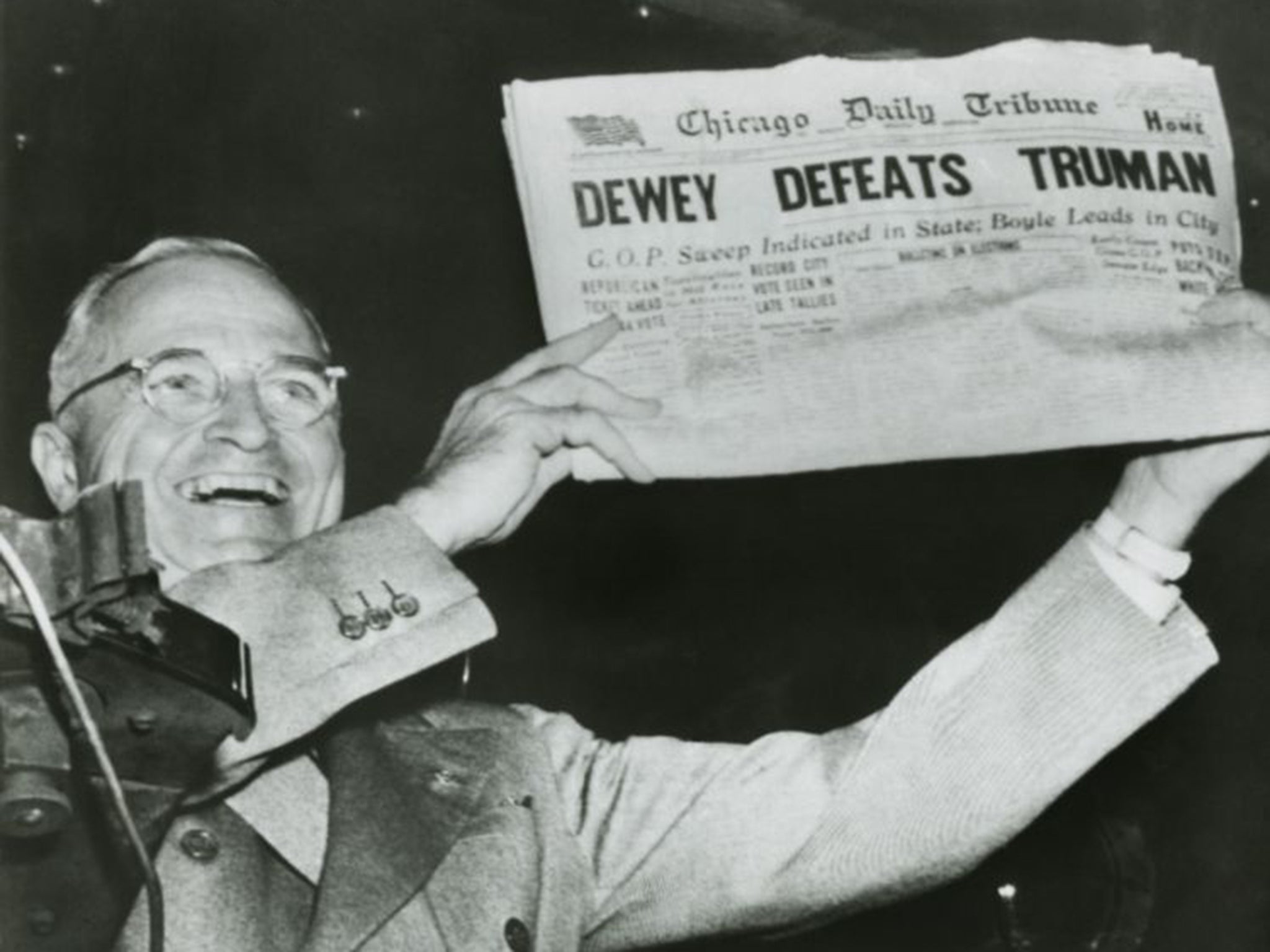 Harry S. Truman, president-elect, holds up edition of Chicago Daily Tribune with headline ‘Dewey Defeats Truman’ in 1948