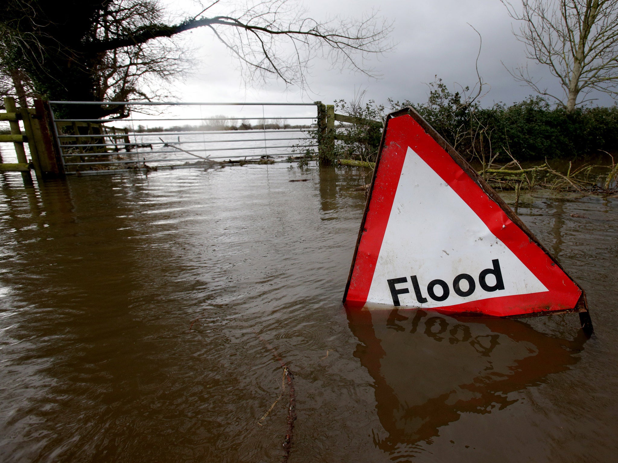 Flood waters surrounding farm buildings in Somerset in January 2014. The rains led to significant flooding in Somerset, Devon, Dorset, Cornwall and the Thames Valley