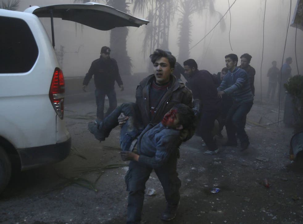 The aftermath of an air strike in the eastern Ghouta region, a rebel stronghold east of the Syrian capital Damascus; Philip Hammond accuses Russia of propping up Assad with air strikes