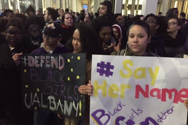 Protesters rally after three black students were beaten and called racial slurs near the University of Albany.