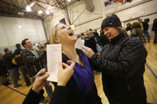 Iowa caucus drama plays out in a high school gymnasium