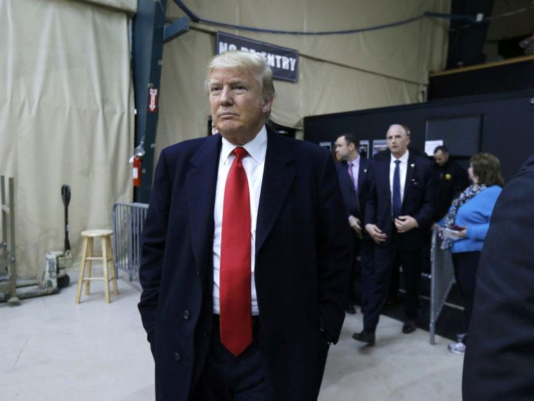 Republican U.S. presidential candidate Donald Trump arrives at a Republican caucus in Iowa