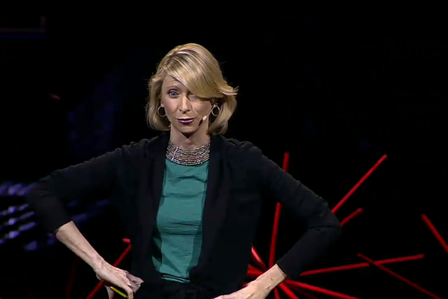 Psychologist Amy Cuddy assumes a 'high power' pose