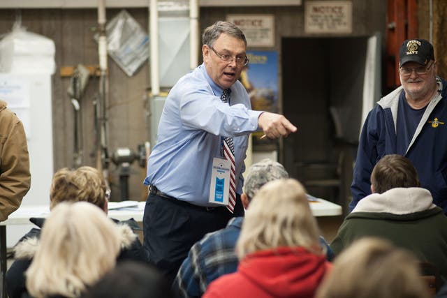 Mike Short, a caucus chairperson, counts caucus attendees at a Democratic Party Caucus at Jackson Township Fire Station on February 1, 2016 in Keokuk, Iowa.