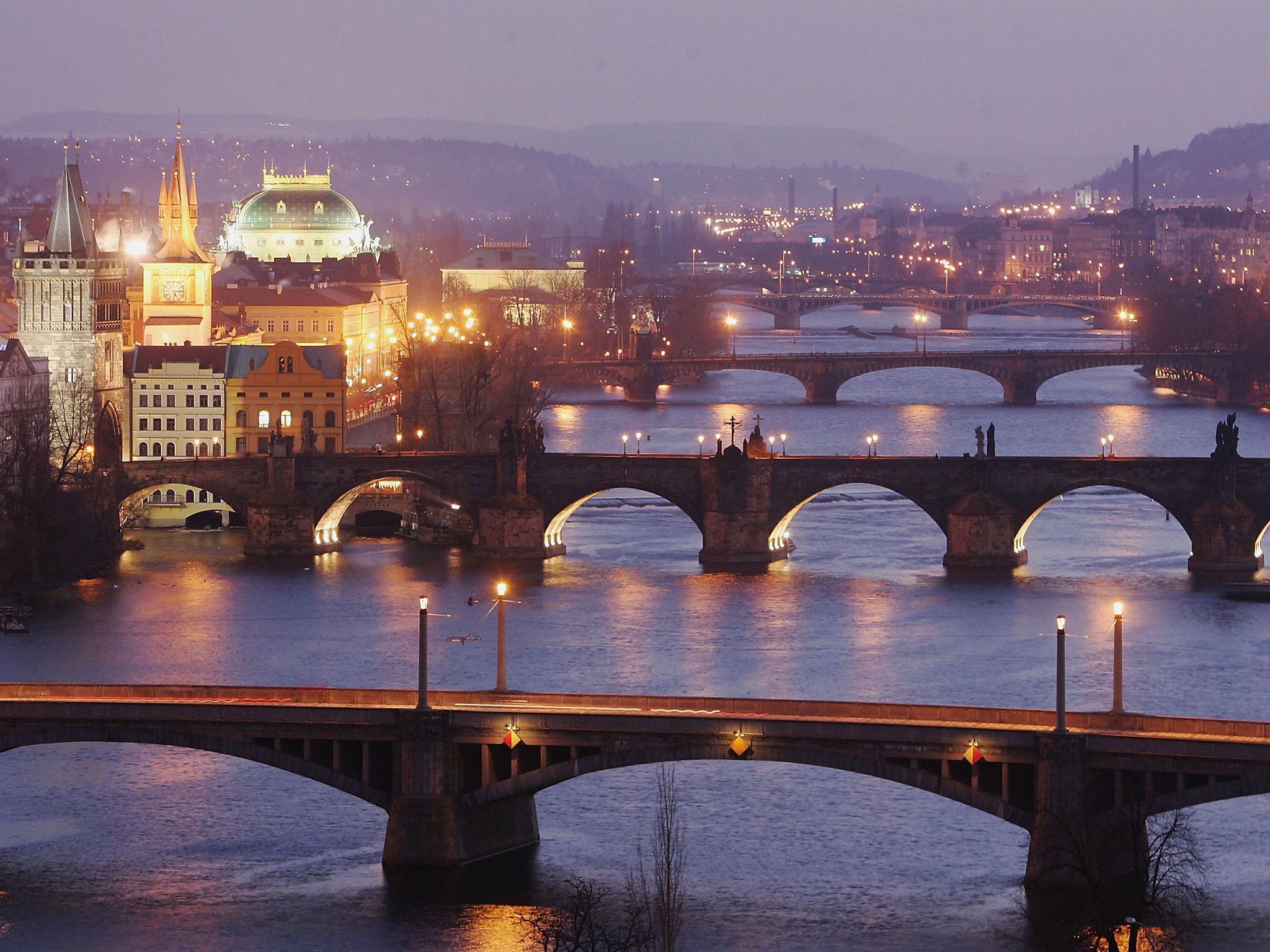 Bridges span the River Vltava in Prague, the capital city of the Czech Republic