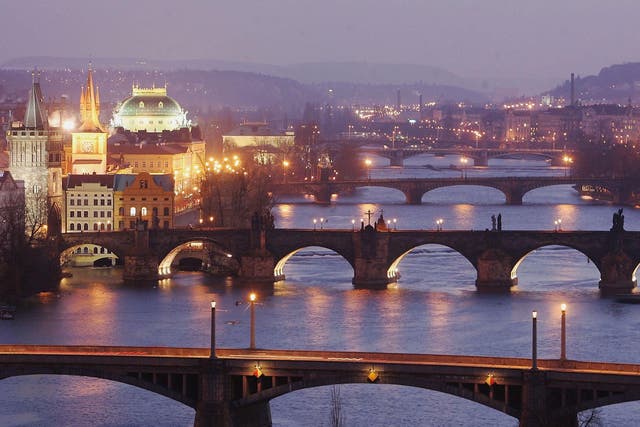 Bridges span the River Vltava in Prague, the capital city of the Czech Republic