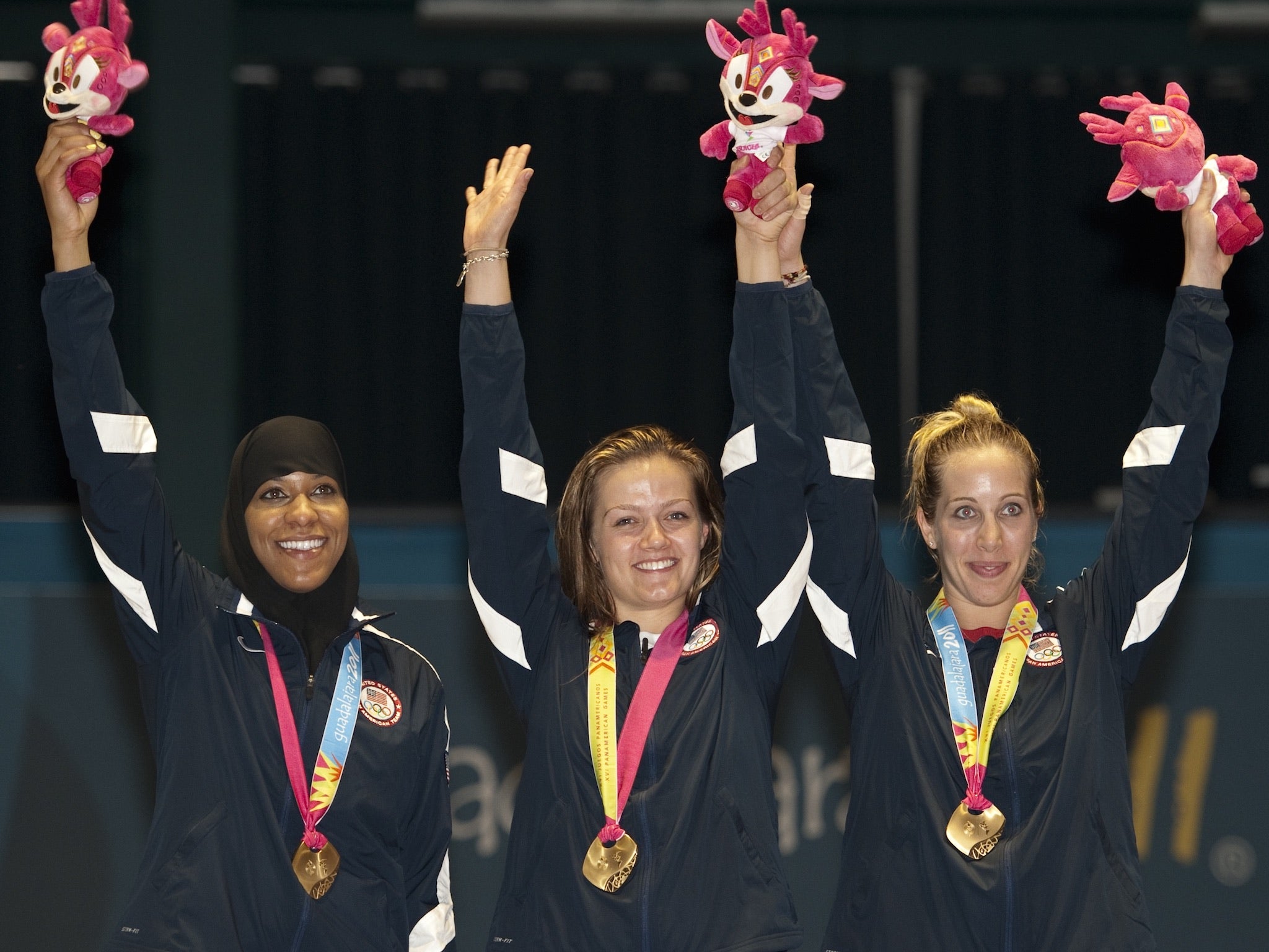 Ibtihaj Muhammad (left) qualified on Saturday for the 2016 Olympic Games and is set to be the first American Olympian to compete in a hijab.