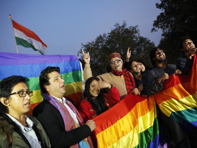 Gay rights supporters celebrate after India's top court agreed to re-examine a colonial-era law that criminalises homosexual acts