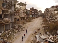 Drone footage reveals devastation of Homs in Syria as Europe's stance towards refugees toughens