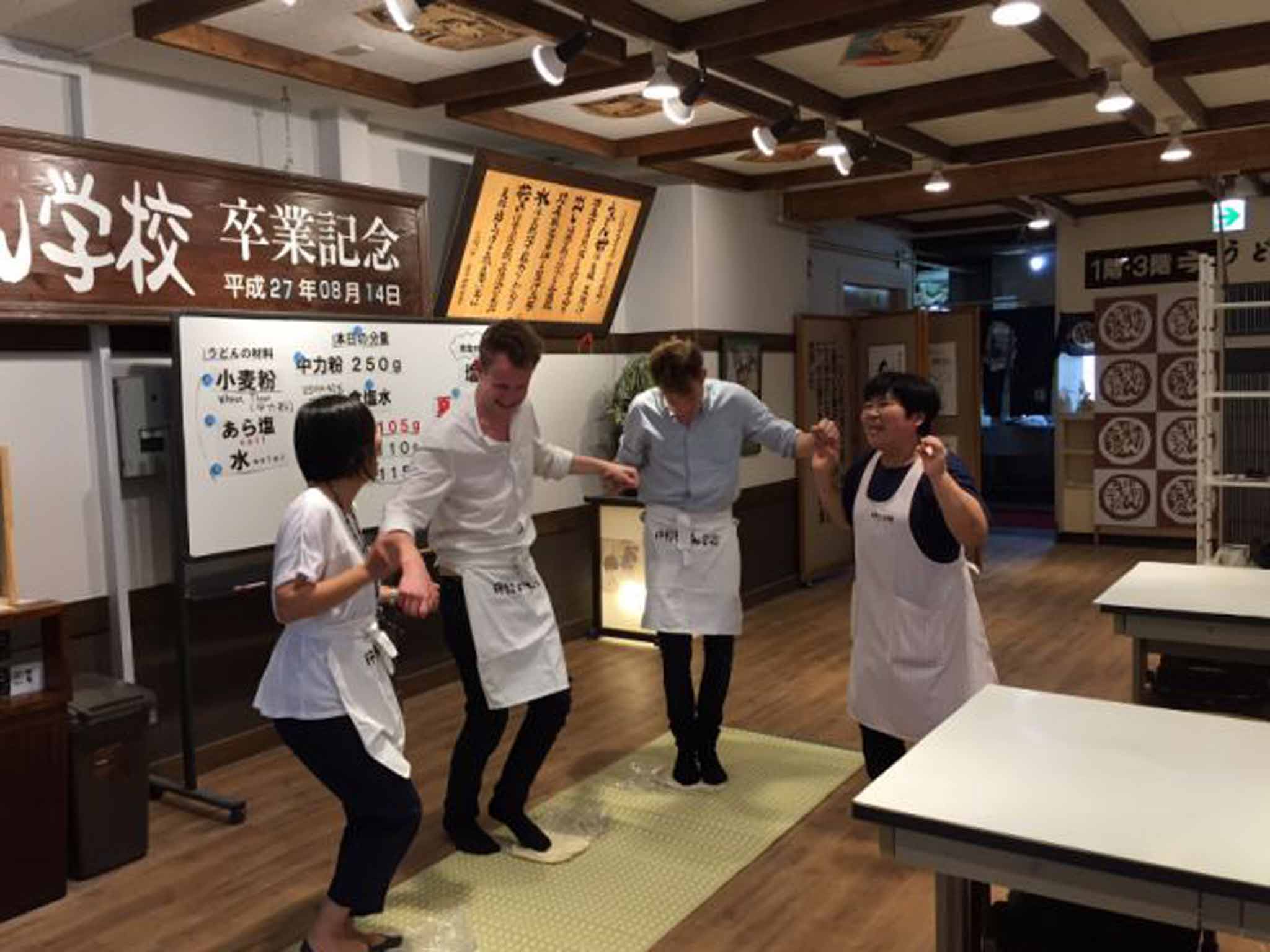 Samuel Muston (centre) puts his stamp on the udon dough