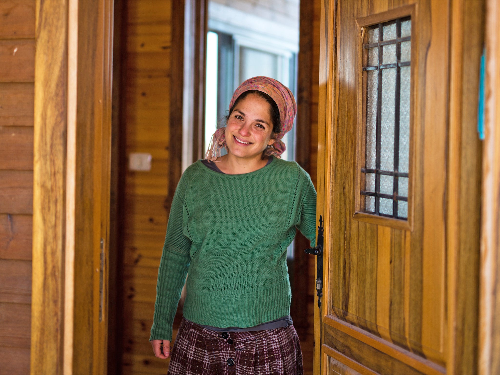 Inbal Zeev at the entrance to her property in Esh Kodesh