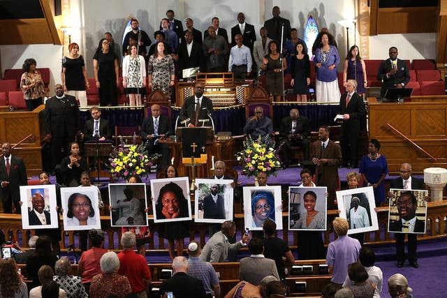 Victims of the Charleston shooting are shown at a prayer service at the Metropolitan AME Church in Washington DC.